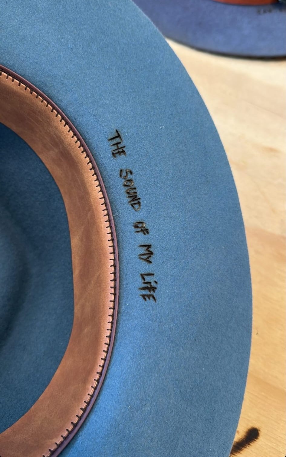 Inside the hat brim, 'The Sound of My Life' burned into the felt