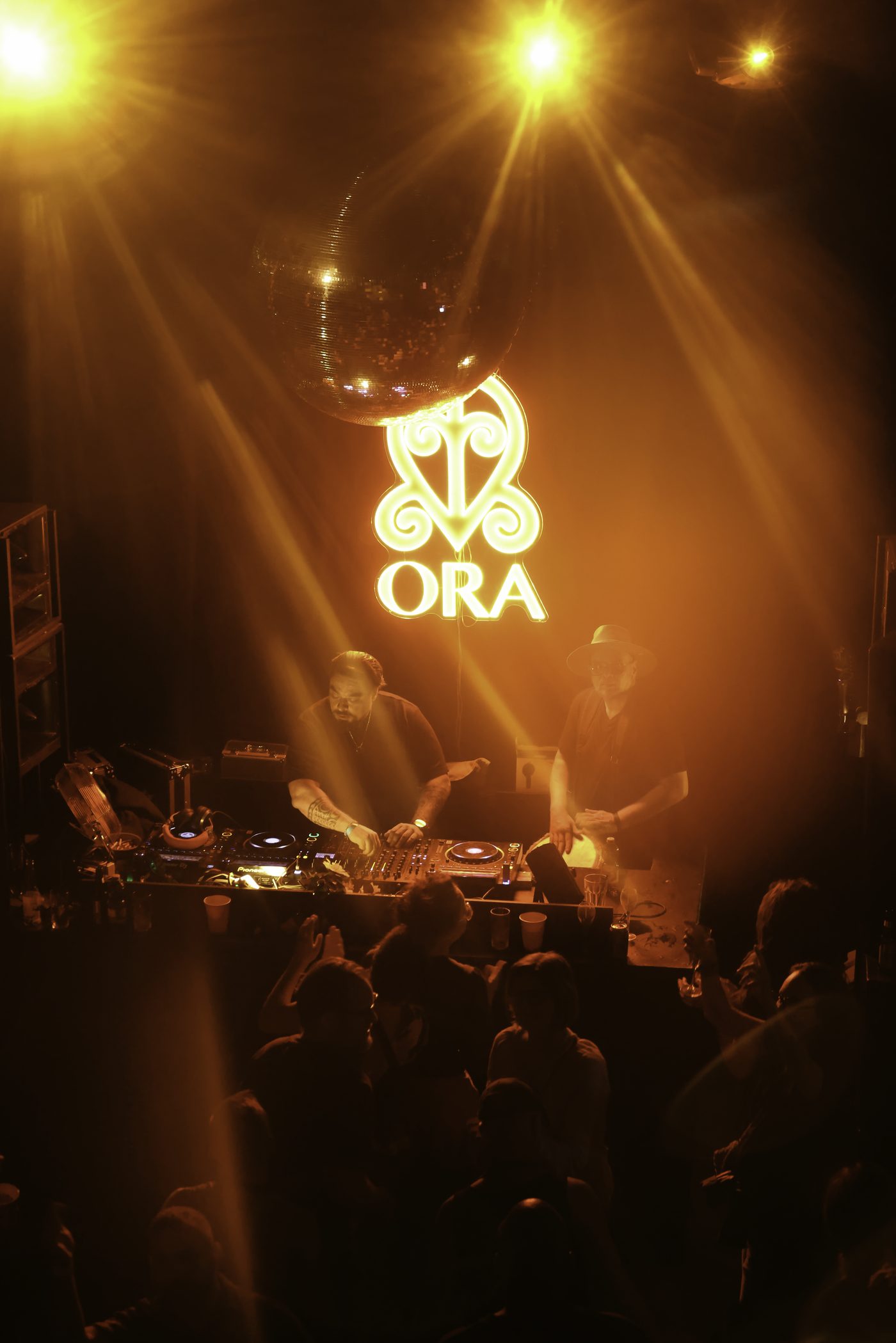 The duo on stage at ORA under yellow lights