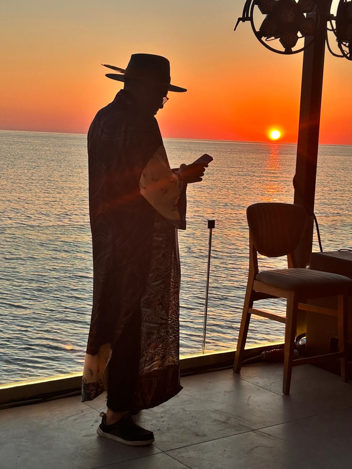 Master M at sunset by the sea